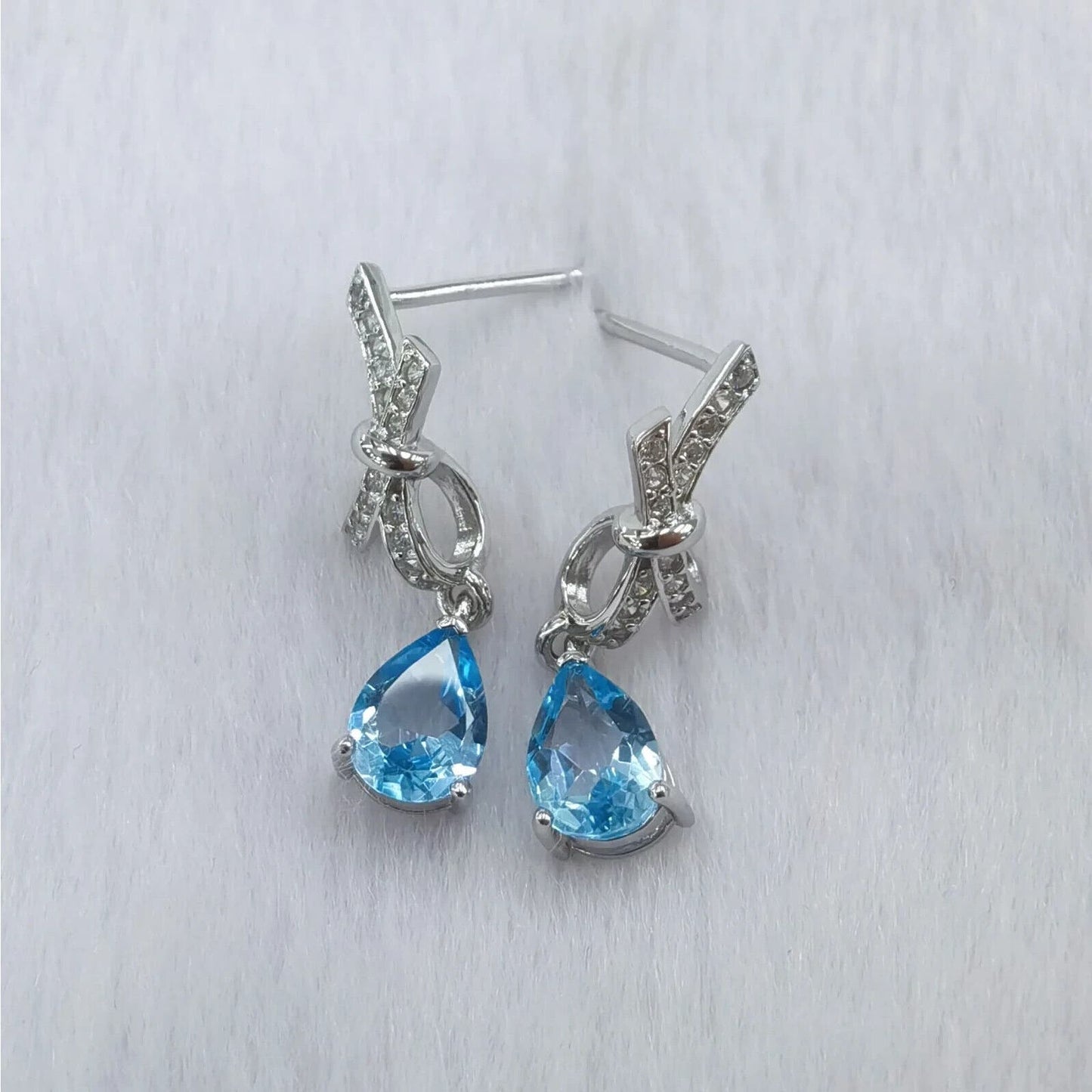 Swiss Blue Topaz Pear Cut Bow Tie Earrings 5x7mm