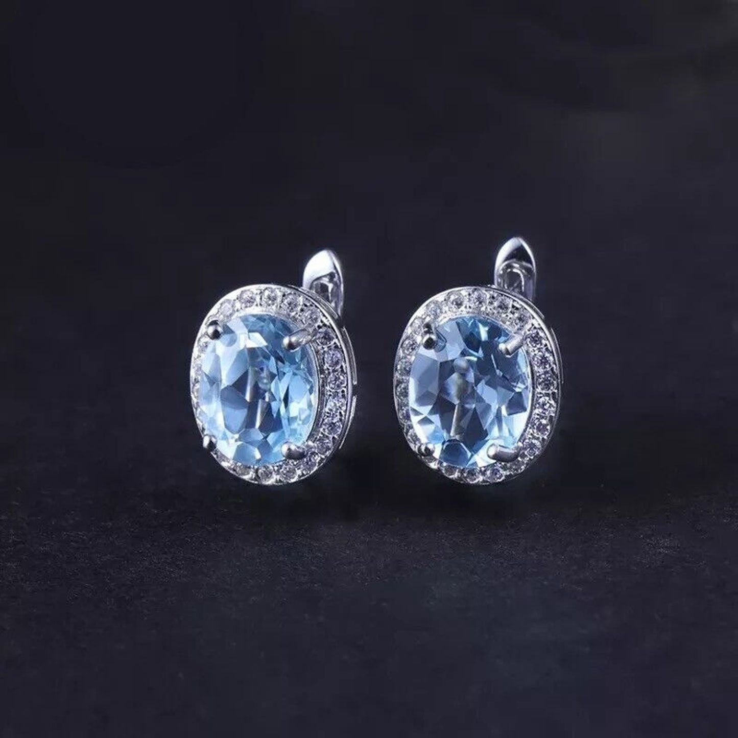 Sky Blue Topaz Oval Cut Clip Earrings 7x9mm